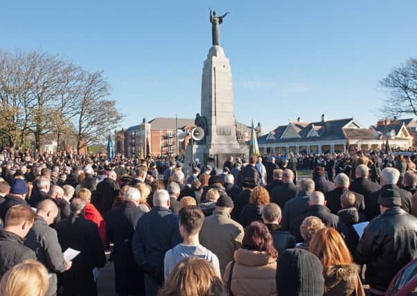 Crowds gather for Remembrance Day at St Annes war memorial in Ashton Gardens