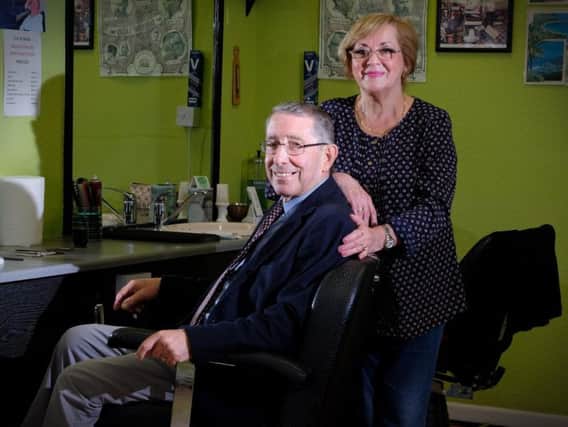 Orazio and Nina Canella in their Cut and Shave barbers shop on Squires Gate Lane