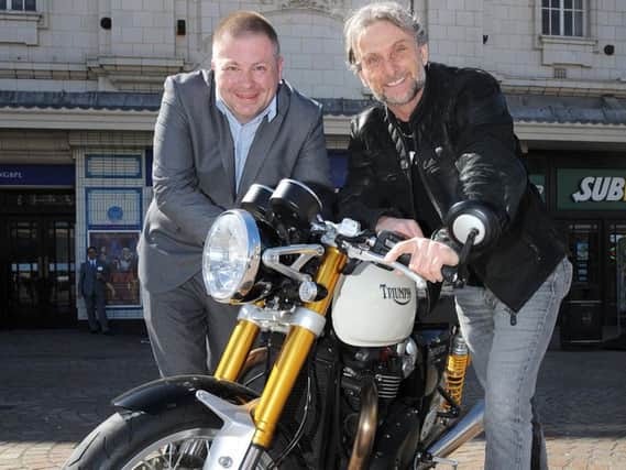 Motrocycle race legend Carl Fogarty with event organiser Gareth Coles and one of Carl's bikes, a Triumph Thruxton R