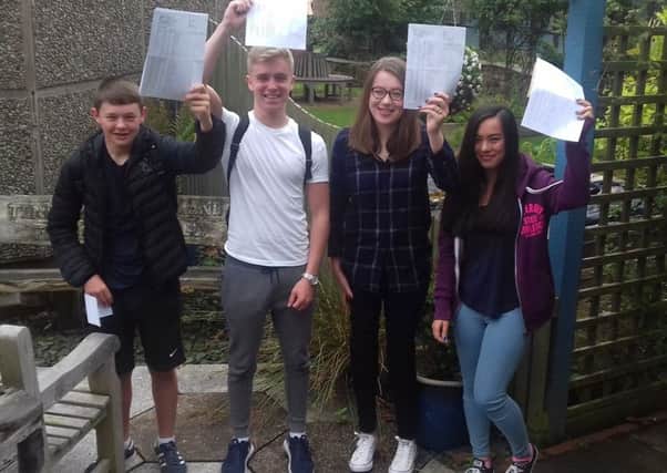 Celebrating their GCSE results are Cardinal Allen students (from left) Sam Davis, Tyler Birch, Sofia Raseta and Katharine Melling.