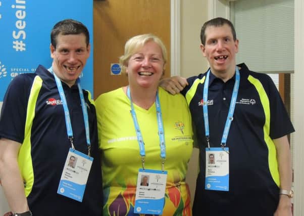 Janice Gower with medal winners Steven and Barry Nicholson