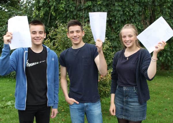 Triplets Sam, Edward and Isobel Russell celebrate their GCSE results at St Bede's RC High School, Lytham
