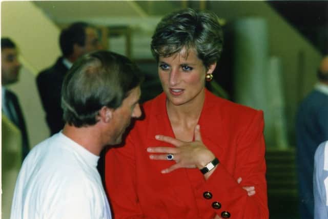 Princess Diana listens intently to one of the workers, at the Industrial Centre for the Blind and Disabled People on Clifton Road , Marton