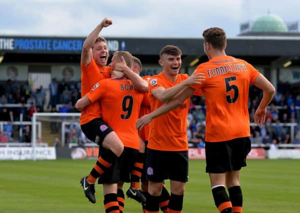 Fylde celebrate Danny Rowe's record-breaking goal Picture: STEVE MCLELLAN