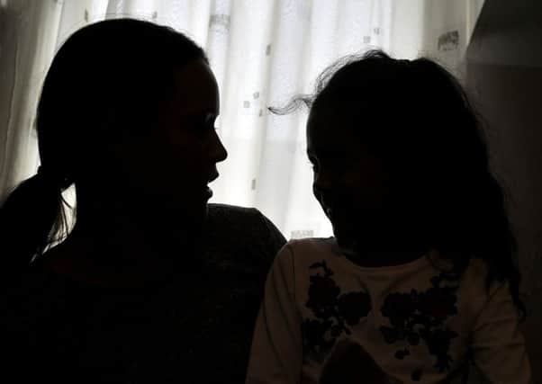 The woman and her daughter are too scared to return home following the raid. The Gazette agreed not to show their faces.