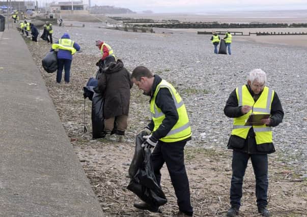 Rossall Beach Residents Community Group, M&S and the Marine Conservation Society at a past clean up at Rossall Beach.