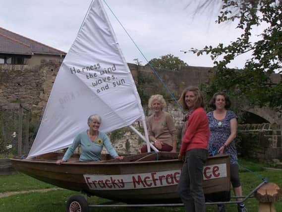 Gina Dowding, standing, with Caroline Jackson, Emily Heath and Mollie Foxall with their boat Fracky McFrackface to protest against fracking in Lancashire