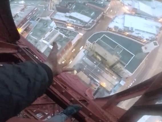 Men who scaled the Tower have been described as 'irresponsible' and 'reckless'