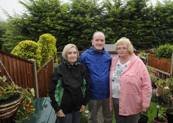 Residents on St Thomas' Close are fed up of overgrown trees in their back gardens which are not being trimmed.  Pictured are Pauline Andrew, Ian Andrew and Kath Barker.