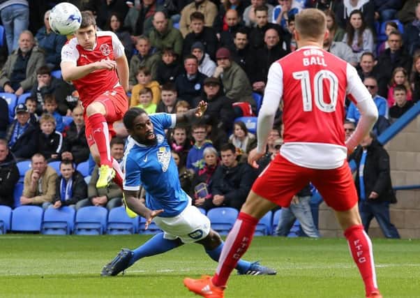 Fleetwood Town's Bobby Grant squeezes a cross into the Peterborough United box