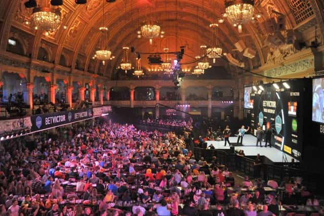 Action from the 2015 World Matchplay Darts championship, held in the Empress Ballroom