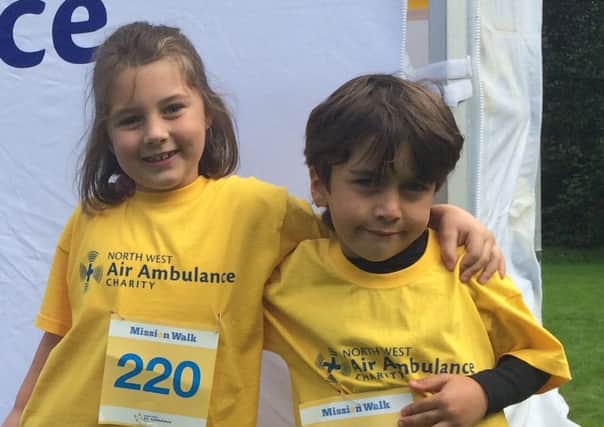 Fred Mason, five, from St Annes, gets ready for the NW Air Ambulance Mission walk with elder sister Lily