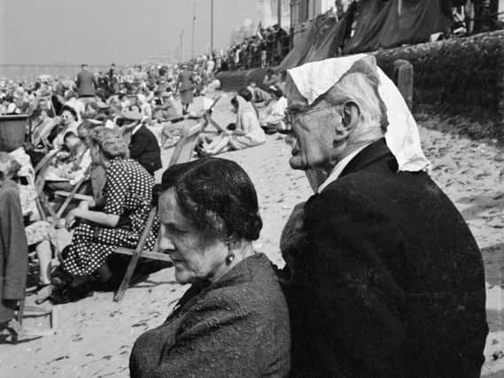 Keeping cool on Blackpool beach   Photo:  John Gay/Historic England/Mary Evans Picture Library