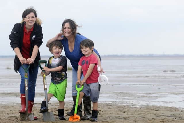 Emily Parr  of Lancashire Wildlife Trust at St Annes beach with Lucy Bridge and children Neo, four and Harrison, five.