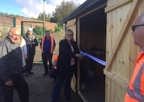 The new shed is unveiled by members of Poulton and Wyre Railway Society and the Back on Track group.