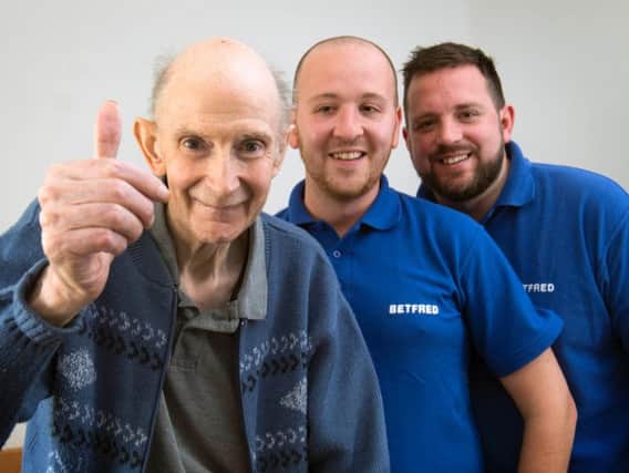 Michael Base (left), 72, and Betfred Staff Jack Bell (centre) and Jamie Scales