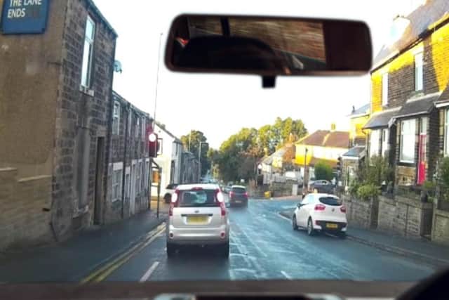 The Kia speeds through the red light