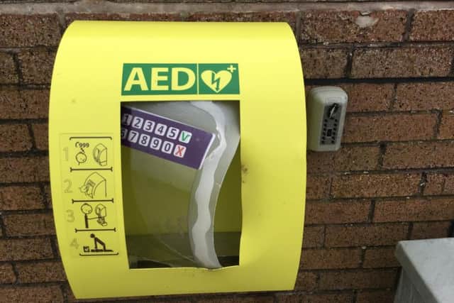 The damaged weatherproof box where the defibrillator unit was kept