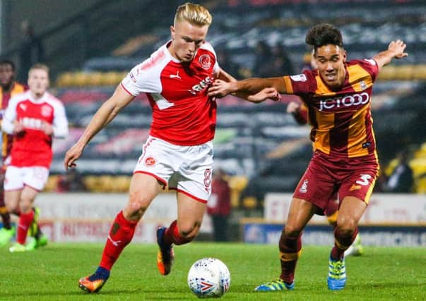 Fleetwood Town's Kyle Dempsey battles with Bradford City's Adam Chicksen