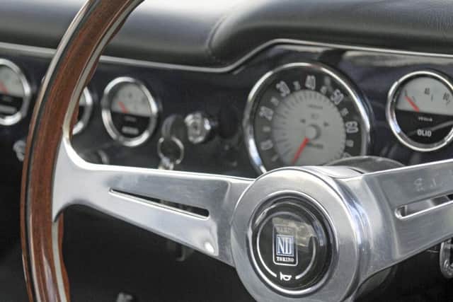 Mirage Automotive Developments have designed and built a sports car based on a 1960s Ferrari.  Inside, the driver's view with classic dials and Wooden steering wheel.
