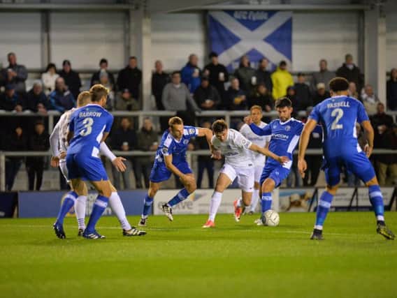 Jonny Smith tries to find a way through to goal for AFC Fylde