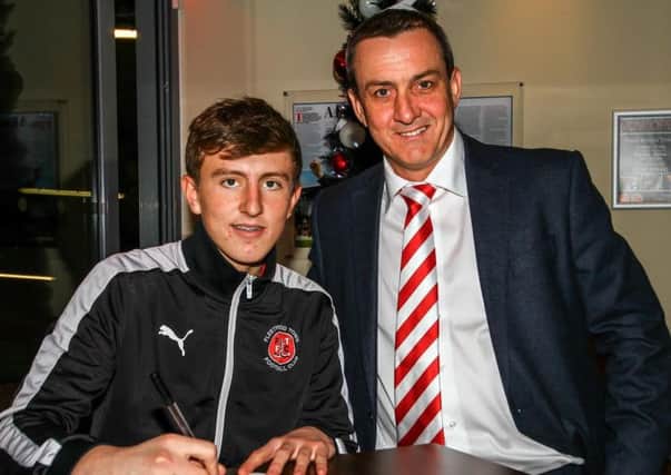 Billy Crellin with chairman Andy Pilley after signing a professional contract at Fleetwood