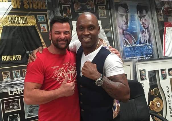 Simon Marx, left, with boxer Nigel Benn, pictured in 2015