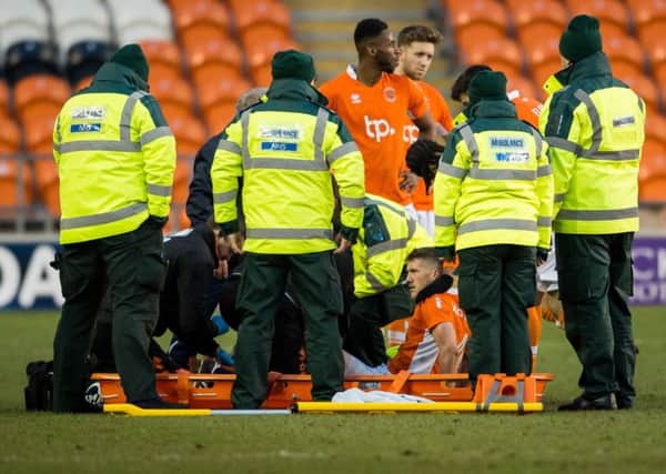 Blackpool's Jim McAlister is put onto a stretcher following his injury