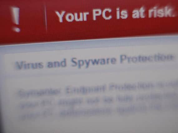 File photo of a virus and spyware warning message on a laptop screen (Picture: Yui Mok/PA Wire)