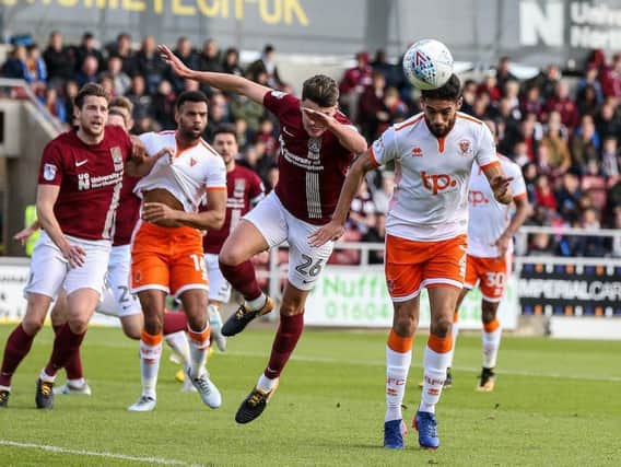 Kelvin Mellor battles for the ball