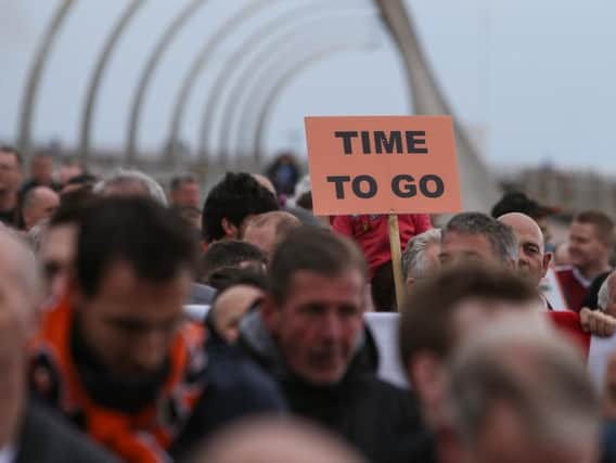 Blackpool fans take part in a protest against owners the Oystens, on Blackpool seafront