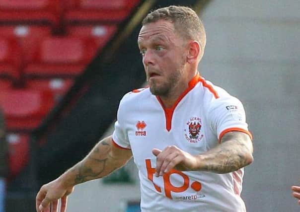 Jay Spearing and his Blackpool team-mates are concentrating on what happens on the pitch