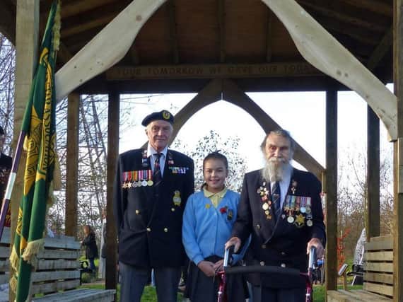 Head girl of Moor Park Primary School Reuben Ormand with merchant navy veteran Bog Vaughan (right), 91, and Barry Price