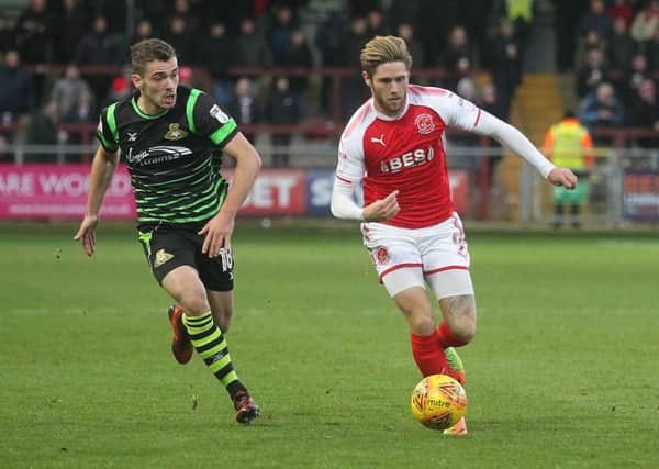 Fleetwood Town's Wes Burns outpaces Doncaster Rovers' Harry Toffolo