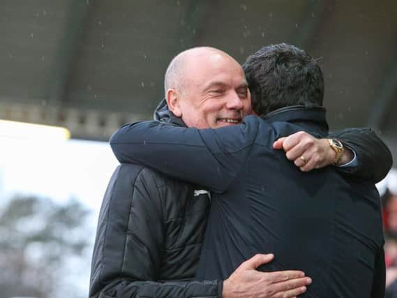 Rosler and Bowyer embrace before the game kicks off