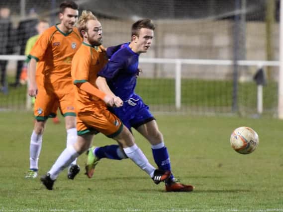 Dan Gray on the attack for Squires Gate against Burscough