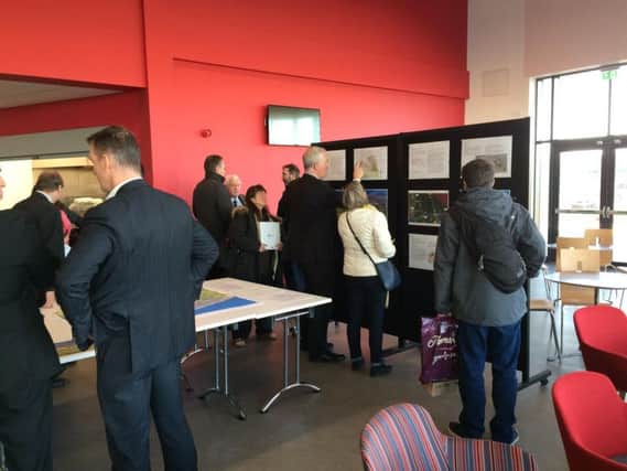 Business representatives and members of the public viewing plans for the Blackpool Airport enterprise zone