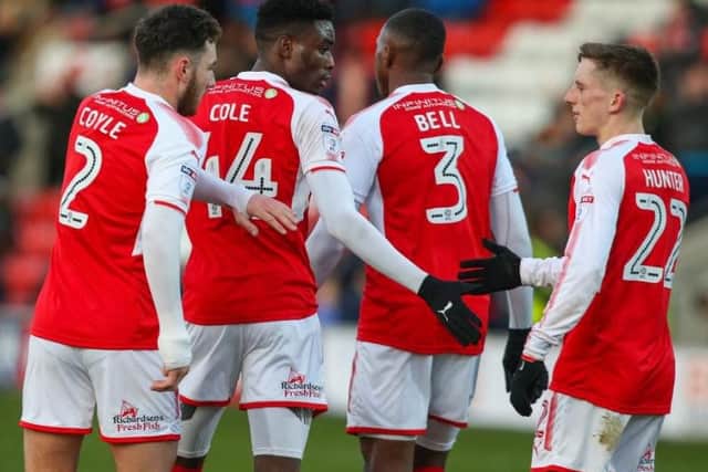 Cole celebrates his goal with Lewie Coyle, Amari'i Bell and Ash Hunter