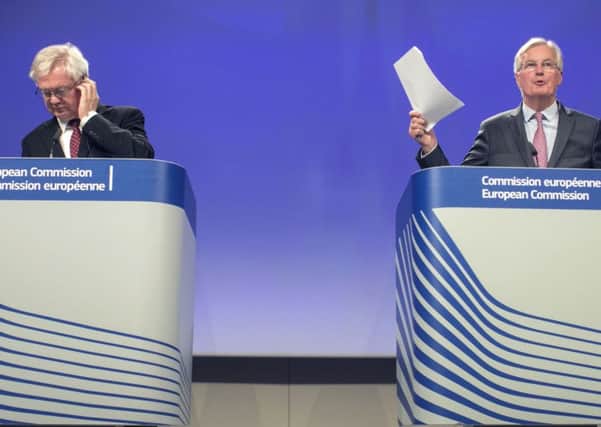 European Union chief Brexit negotiator Michel Barnier, right, and British Secretary of State for Exiting the European Union David Davis address a media conference at EU headquarters in Brussels on Thursday, Sept. 28, 2017. The EU and Britain concluded a fourth round of Brexit negotiations on Thursday. (AP Photo/Olivier Matthys)