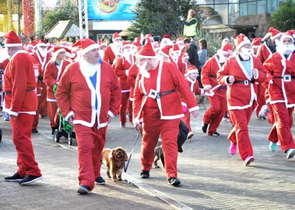 Picture by Julian Brown 03/12/17  The race begins  Santa Dash from the Sandcastle to Central Pier, Blackpool, and back in aid of Brian House Children's Hospice