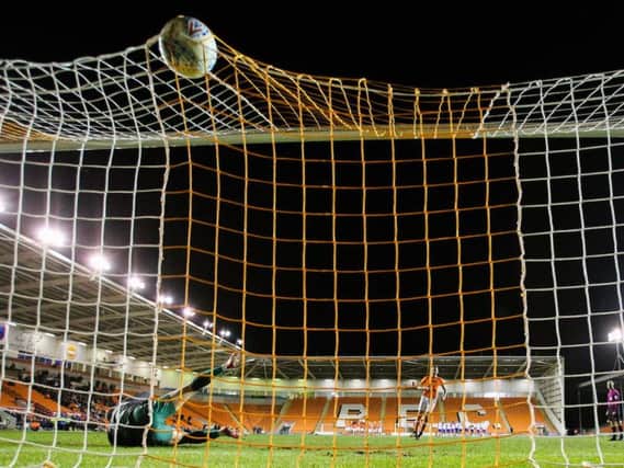 Scott Quigley scores the winning penalty against Mansfield last night