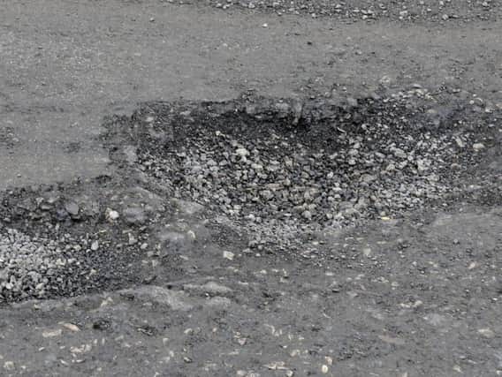 Potholes on Cropper Road