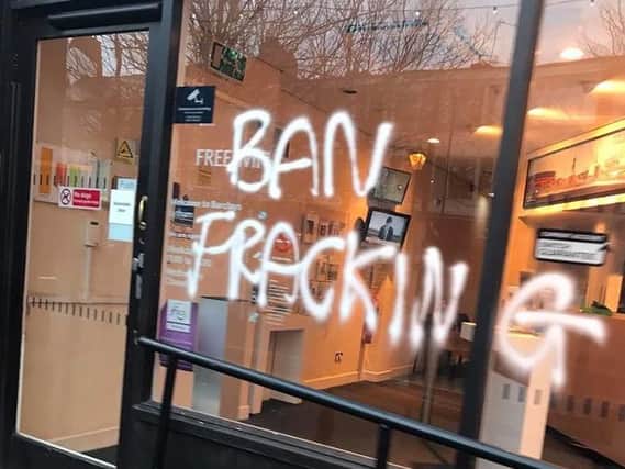 The words 'Ban fracking' were spray painted onto the windows of Barclays in Clifton Street. Photo: Michael Sayward.