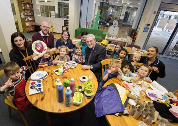 UCLan vice chancellor Prof Mike Thomas with children form the pre-school centre at the In The City shop