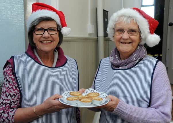A coffee morning and fair raising funds for Action for Children was held at Lytham Methodist Church hall.
 Serving mince pies are Julie Butler (left) and Beryl Crossley.