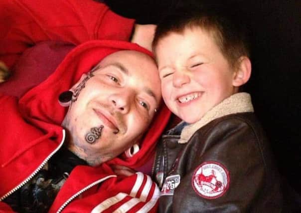James Krejzl, who died 10 days after being diagnosed with an agressive form of leukemia, with his son Ethan