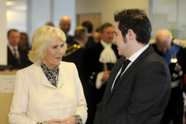The Duchess of Cornwall visits the offices of The Silver Line where Esther Rantzen is president and founder.  She is pictured with staff member Sean Tyler.