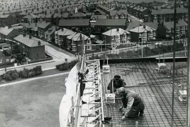 Men working on the high rise flats at Queenstown, Layton, in 1963