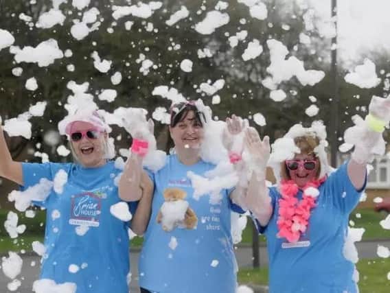 Staff and volunteers at last year's Brian House Bubble Rush. L-R are Toni Isaksen, Vicki Murphy and Sue Pelling