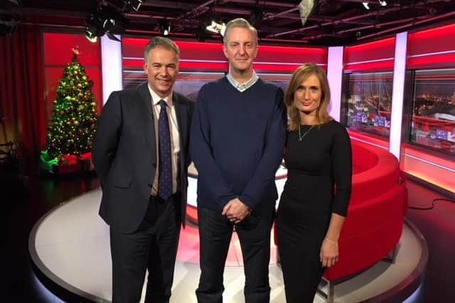 Poet Tony Walsh with BBC North West Tonight presenters Roger Johnson and Annabel Tiffin